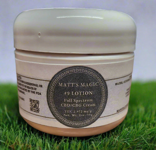 2oz Jar of Matt's Magic #9 Full Spectrum CBD/CBG Cream on a grass surface